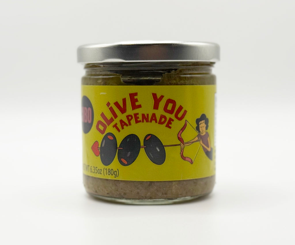 Jar of Olive Tapenade on a white background